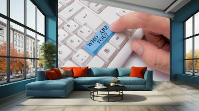 Conceptual hand writing showing Who Are You question. Concept meaning asking about demonstrating identity or demonstratingal information White pc keyboard with note paper above the white background Wall mural