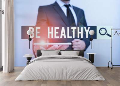 Handwriting text Be Healthy. Conceptual photo to be vigorous and totally free from bodily or mental diseases Male human wear formal work suit hold smart hi tech smartphone use one hand Wall mural