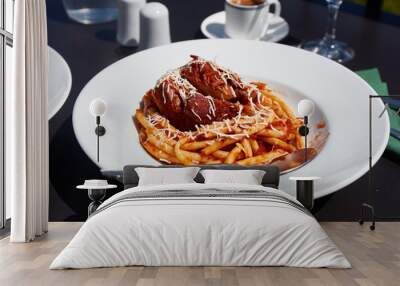 Freshly served in the restaurant pastitsada of beef with bucatini pasta. The most famous and characteristic dish from the island of Corfu in Greece. Wall mural