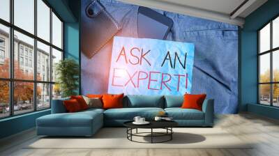 Text sign showing Ask An Expert. Business photo text confirmation that have read understand and agree with guidelines Smartphone device inside trousers front pocket with wallet and note paper Wall mural