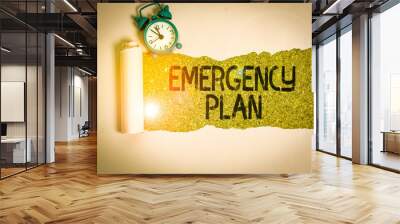 Text sign showing Emergency Plan. Business photo showcasing procedures for handling sudden or unexpected situations Alarm clock and torn cardboard placed above a wooden classic table backdrop Wall mural