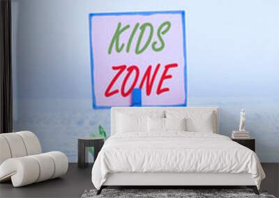 Text sign showing Kids Zone. Business photo text An area or a region designed to enable children to play and enjoy Reminder pile colored crumpled paper clothespin reminder white wooden space Wall mural