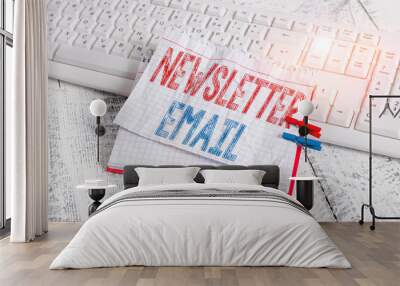 Text sign showing Newsletter Email. Business photo text email sent to subscribers informing them about the news notebook paper reminder clothespin pinned sheet white keyboard light wooden Wall mural