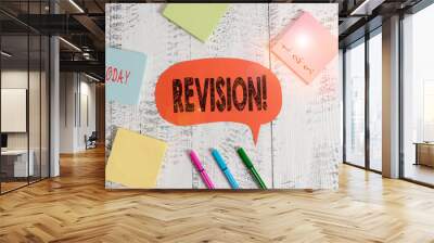 Text sign showing Revision. Business photo text action of revising over someone like auditing or accounting Ballpoints pens blank colored speech bubble sticky notes wooden background Wall mural