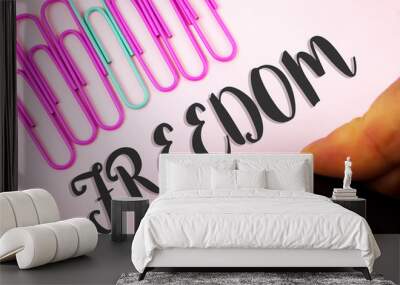 Word writing text Freedom. Business concept for Going out for a vacation, students having liberty to go world tour written by Man holding Marker Plain Pink background Paper Pins next to it. Wall mural