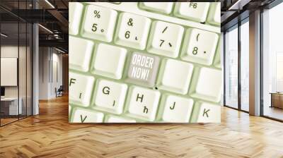 Word writing text Order Now. Business photo showcasing confirmed request by one party to another to buy sell White pc keyboard with empty note paper above white background key copy space Wall mural