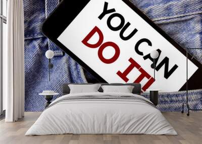 Word writing text You Can Do It Motivational Call. Business concept for Inspirational Message Motivational Positive Text two Words written black Phone white Screen front pocket blue jeans Wall mural