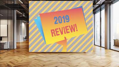 Writing note showing 2019 Review. Business concept for remembering past year events main actions or good shows Hand Holding Blank Space Color File Folder with Sheet Inside Wall mural