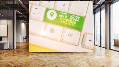 Writing note showing Let S Work Together. Business concept for Unite and Join Forces to Achieve a Common Goal White pc keyboard with note paper above the white background Wall mural