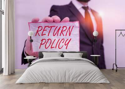 Writing note showing Return Policy. Business concept for return or exchange defective merchandise that they buy before Male human wear formal work suit with office look hold book Wall mural