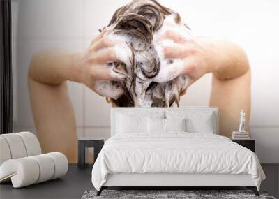 Woman washing her hair in shower Wall mural