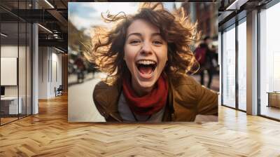 Portrait of a happy girl on a blurred background, beautiful lighting. Wall mural