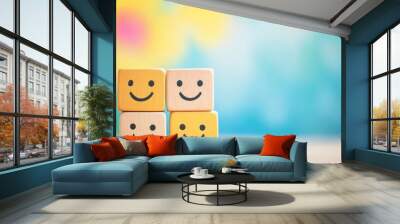 Colorful, happy wooden blocks with smiling faces on vibrant background Wall mural