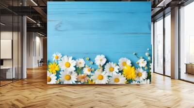 Fresh daisies arranged on a rustic blue wooden background, creating a serene and calming ambiance Wall mural