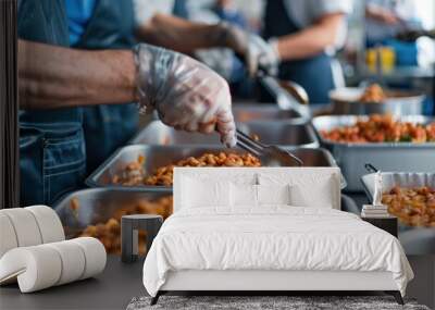 Gloved hands serve beans in large kitchen, focusing on food preparation and hygiene Wall mural