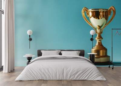 Golden trophy on a teal blue background Wall mural