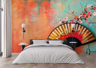 Japanese hand fan with floral design on vibrant abstract background Wall mural