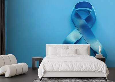 Light blue awareness ribbon on background Wall mural