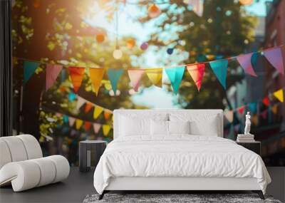 Sunlit outdoor festival with colorful triangular flags and trees Wall mural