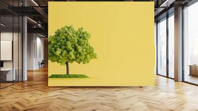 Vivid green tree on a bright yellow background symbolizing nature and vitality Wall mural