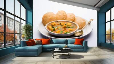 Aloo Puri or Potato curry with fried Poori, popular Indian breakfast / lunch / dinner menu. Wall mural