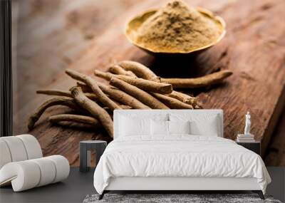 Ashwagandha / Aswaganda OR Indian Ginseng is an Ayurveda medicine in stem and powder form. Isolated on plain background. selective focus Wall mural