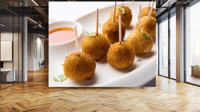 Crispy Veg lollipop recipe made using boiled potato with spices covered with corn flour and bread crumbs coating and then deep fried, served with toothpick or ice cream stock inserted in it with sauce Wall mural