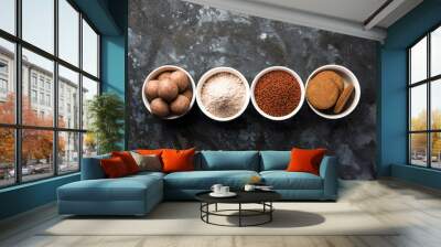 Nachni / Ragi laddu and biscuits or cookies made using  finger millet, sugar and ghee. It's a healthy food from India. Served in a bowl or plate with raw whole and powder. Selective focus Wall mural