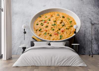 Vegetable masala oats khichadi served in a bowl. selective focus Wall mural