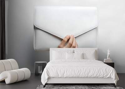 Hand holding a white leather blank laptop case Mockup. White Background. Laptop cover Mockup. Minimalistic style. Wall mural