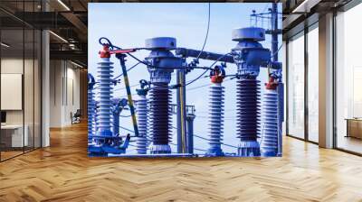 High voltage power transformer substation.High voltage electric power transformers in the blue cloudy sky and trees.Banner.Toned. Wall mural