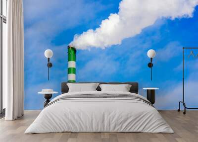 One Industrial smoke pipe from chimney on blue cloudy sky. Wall mural