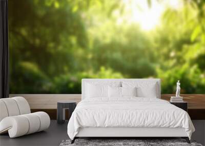 empty wooden table top, positioned in front of a blurred background of a lush green garden bathed in soft sunlight Wall mural