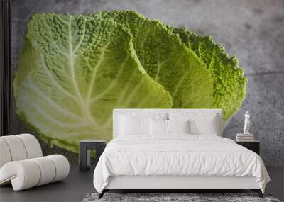 Green leaves raw fresh savoy cabbage on a dark background. Savoy cabbage leaf close-up, Wall mural