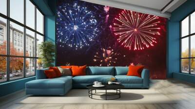 A dazzling display of red, white, and blue fireworks bursting in the sky, perfect for celebrating the Fourth of July and American Independence Day. The vibrant fireworks light up the night sky with pa Wall mural