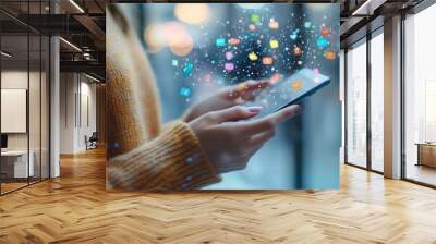 A person is using their smartphone. They're scrolling through social media, interacting with friends and online content Wall mural