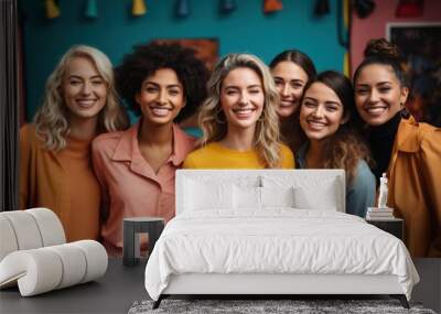 A diverse group of happy women smiling together, showcasing friendship and unity in a vibrant setting Wall mural