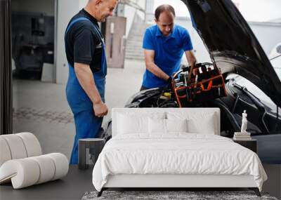 Car repair and maintenance theme. Two mechanics in uniform working in auto service, checking engine. Wall mural