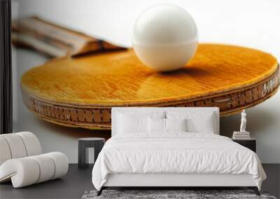 Close-up of ping pong racket and ball on white background Wall mural