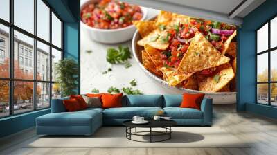 Corn nachos with fresh salsa on white textured background Wall mural