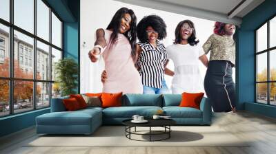 Four best friends. Young adrican women loud laugh, having fun and spend time together. Wall mural