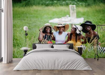 Group of african american girls celebrating birthday party outdoor with decor. Wall mural