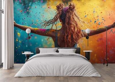 Joyful woman celebrates with vibrant colored powder outdoors Wall mural