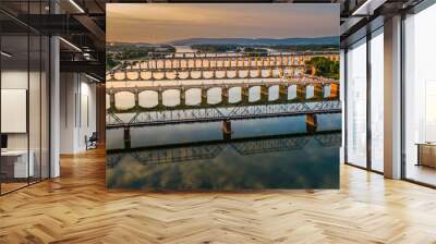 Many bridges over river in sunset, Harrisburg, Pennsylvania, Susquehanna river crossings aerial view, dramatic evening reflection in water, scenic American vista Wall mural