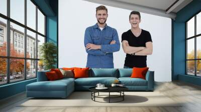 A full-length shot of two friends standing Wall mural