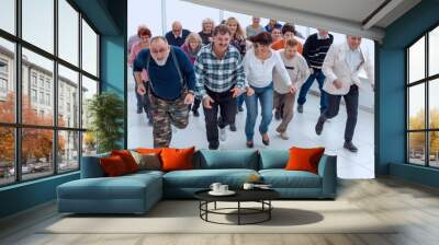 a group of pensioners are preparing to run forward Wall mural