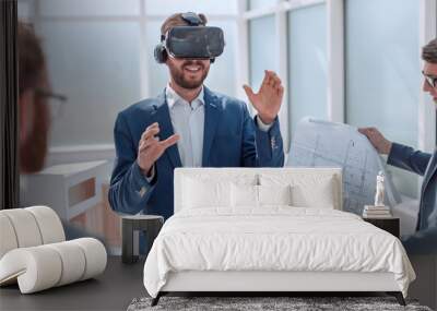 architect using virtual reality glasses in the workplace. Wall mural