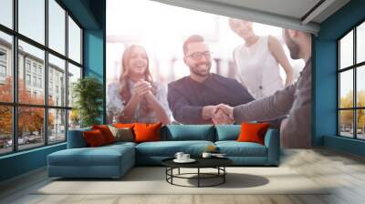 background image of the handshake of business partners in the office Wall mural