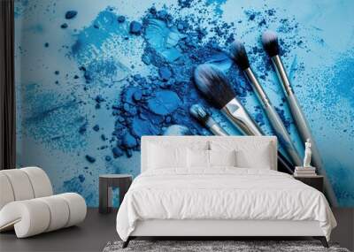 Blue powder with makeup brushes on a blue background Wall mural