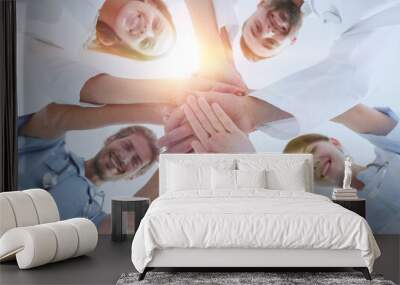 bottom view.a team of doctors at the medical center clasped their hands together Wall mural